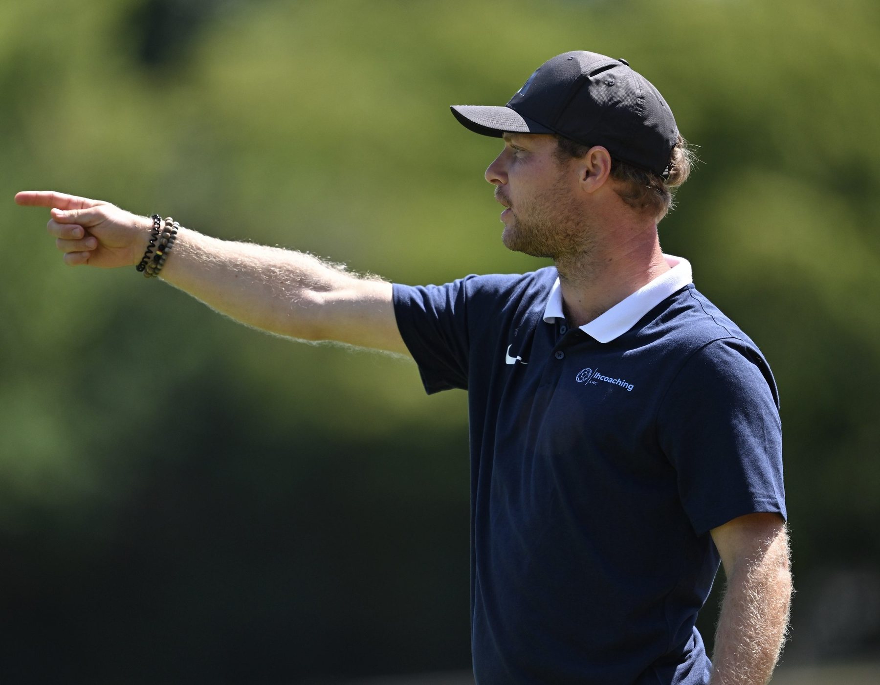 Coach directing players during training